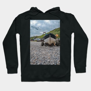 Front end view of fishing boat on the beach Hoodie